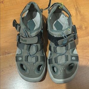 Teva Tan and Black Sandals